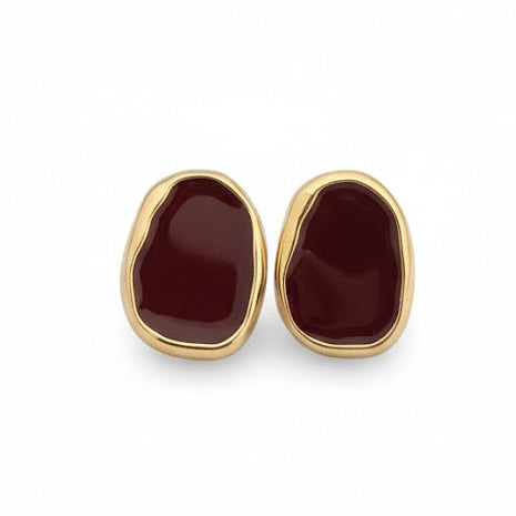 Pair of gold earrings with red stones 